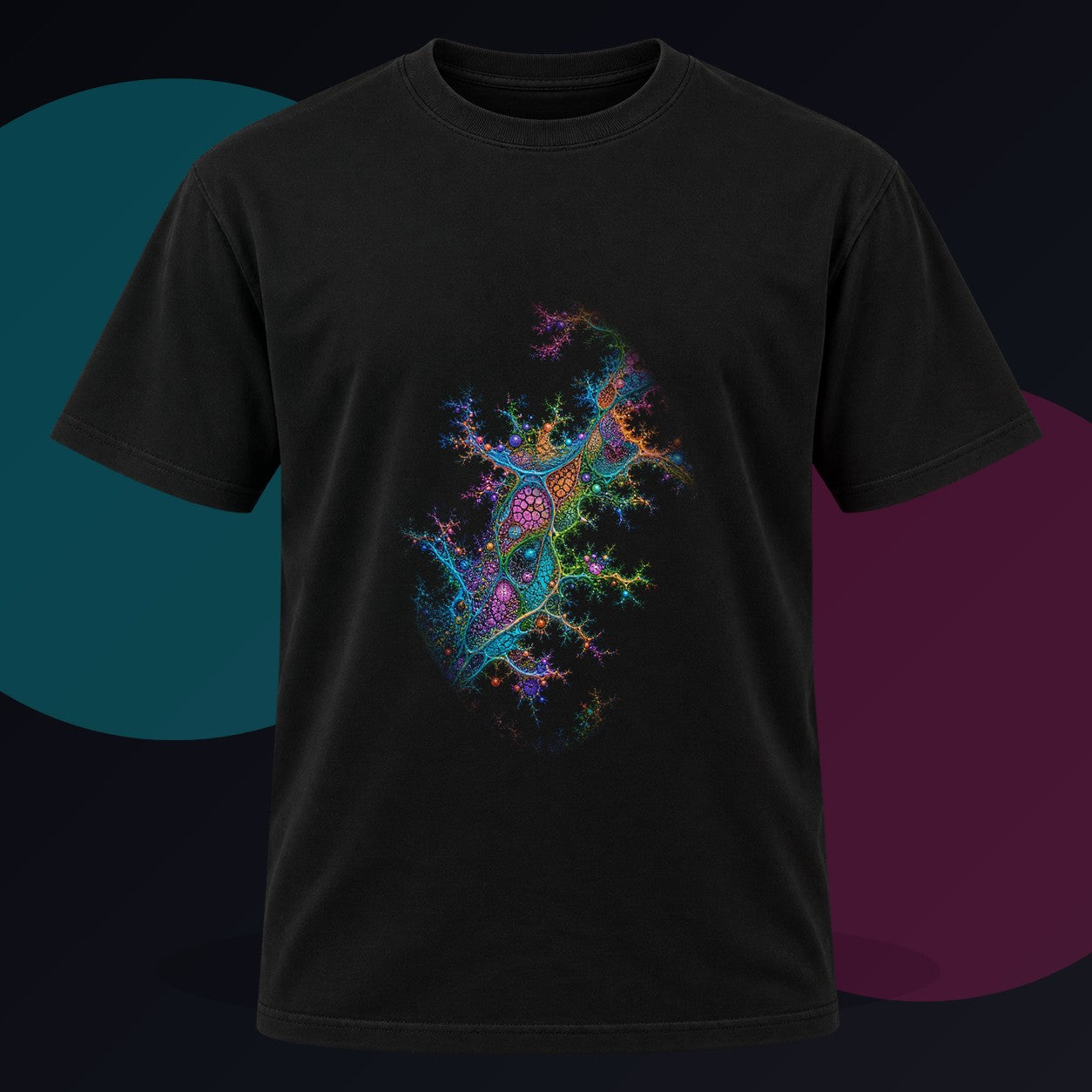 Coral Logic Spread original KOSVYRE design on a black graphic tee against a graphite studio background